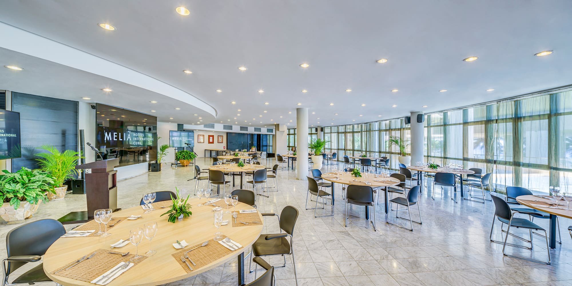 a large room with tables and chairs