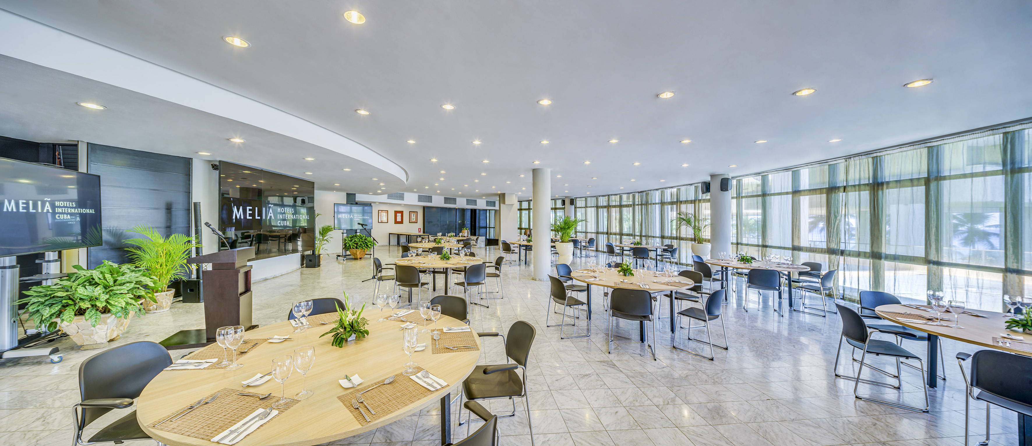 a large room with tables and chairs