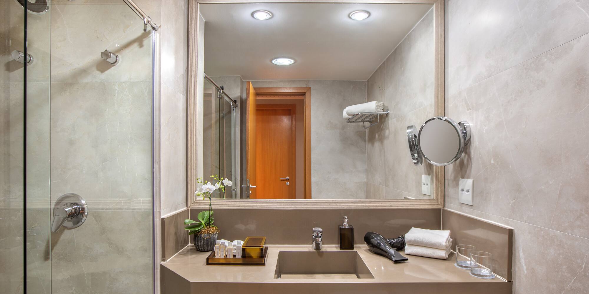 a bathroom with a mirror and sink