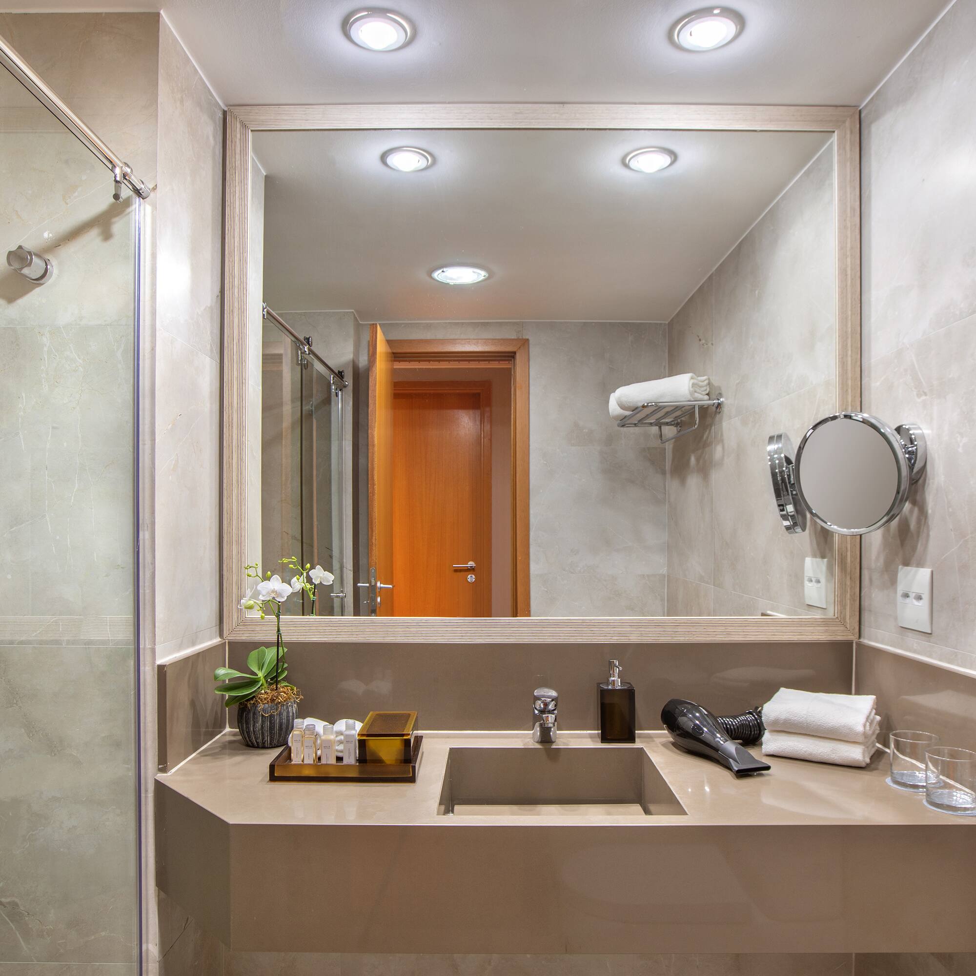 a bathroom with a mirror and sink