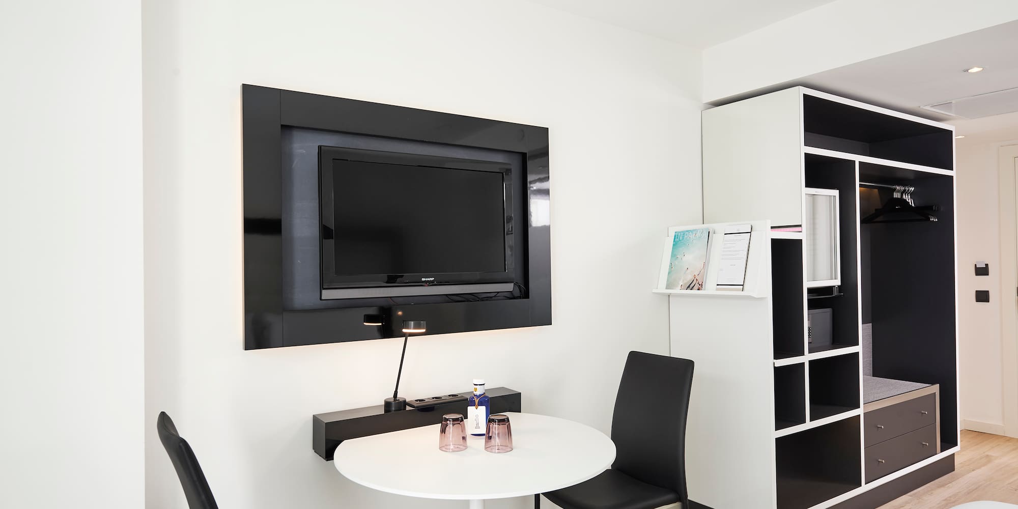 a room with a tv and a table