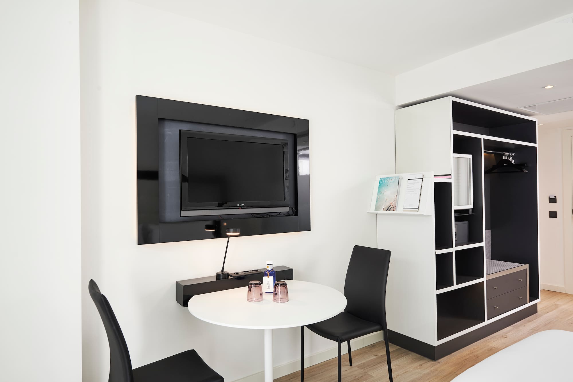 a room with a tv and a table