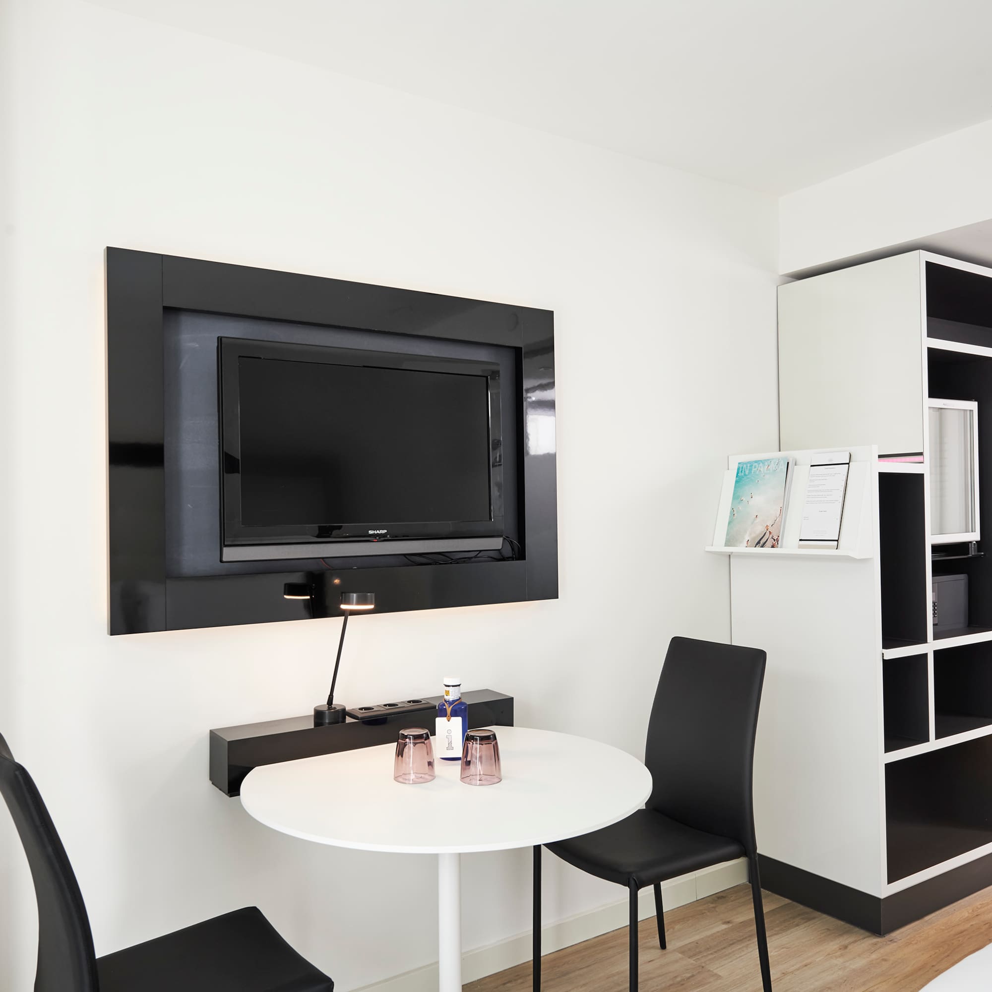 a room with a tv and a table