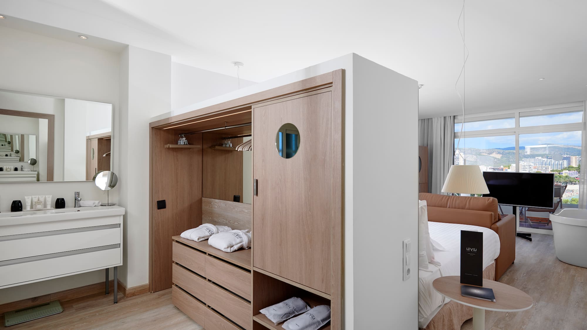 a room with a bed and a mirror