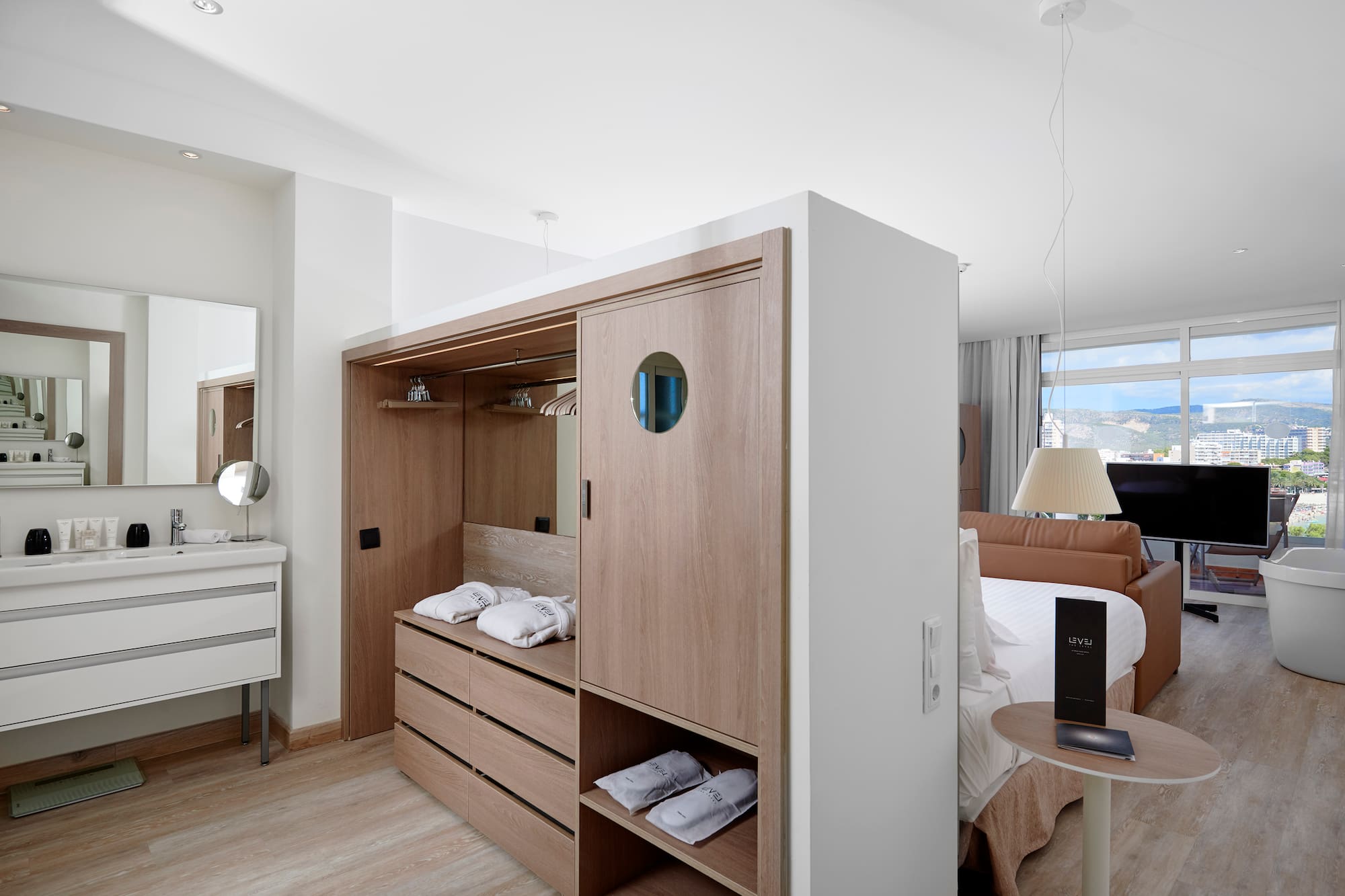 a room with a bed and a mirror