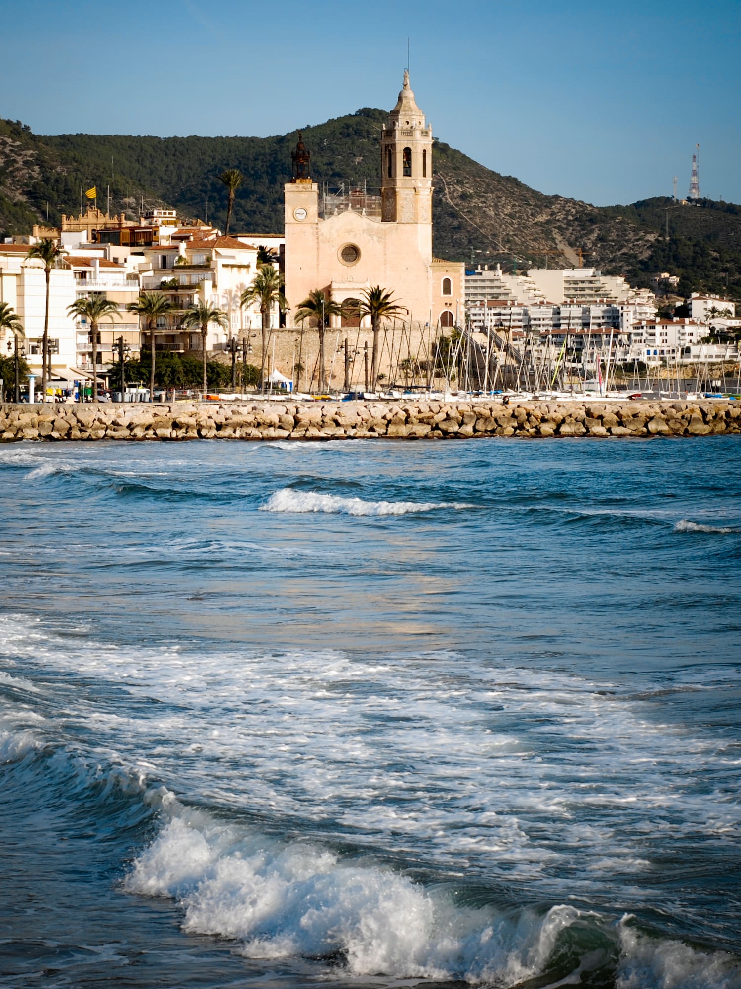 a body of water with a body of water and a building in the background