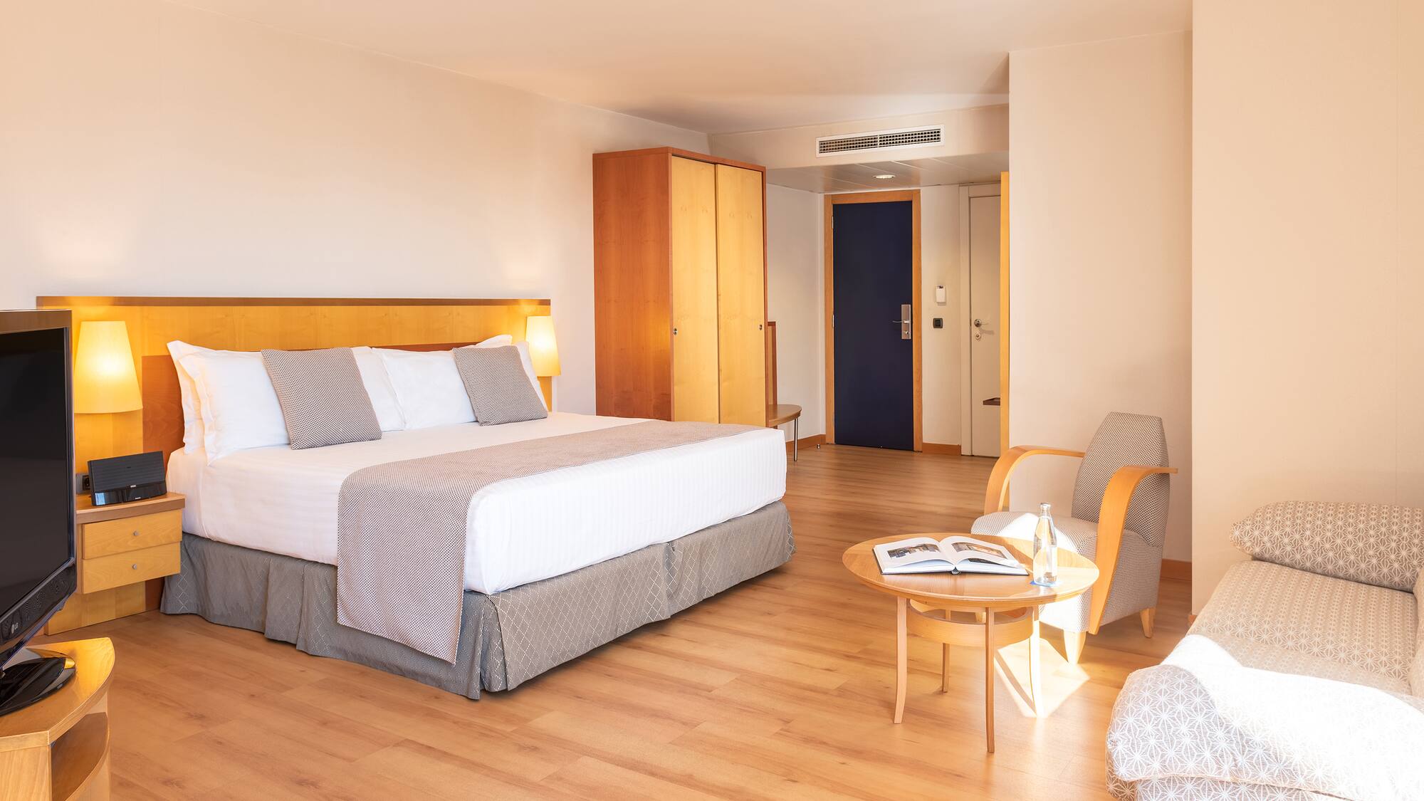 a room with a bed and a chair