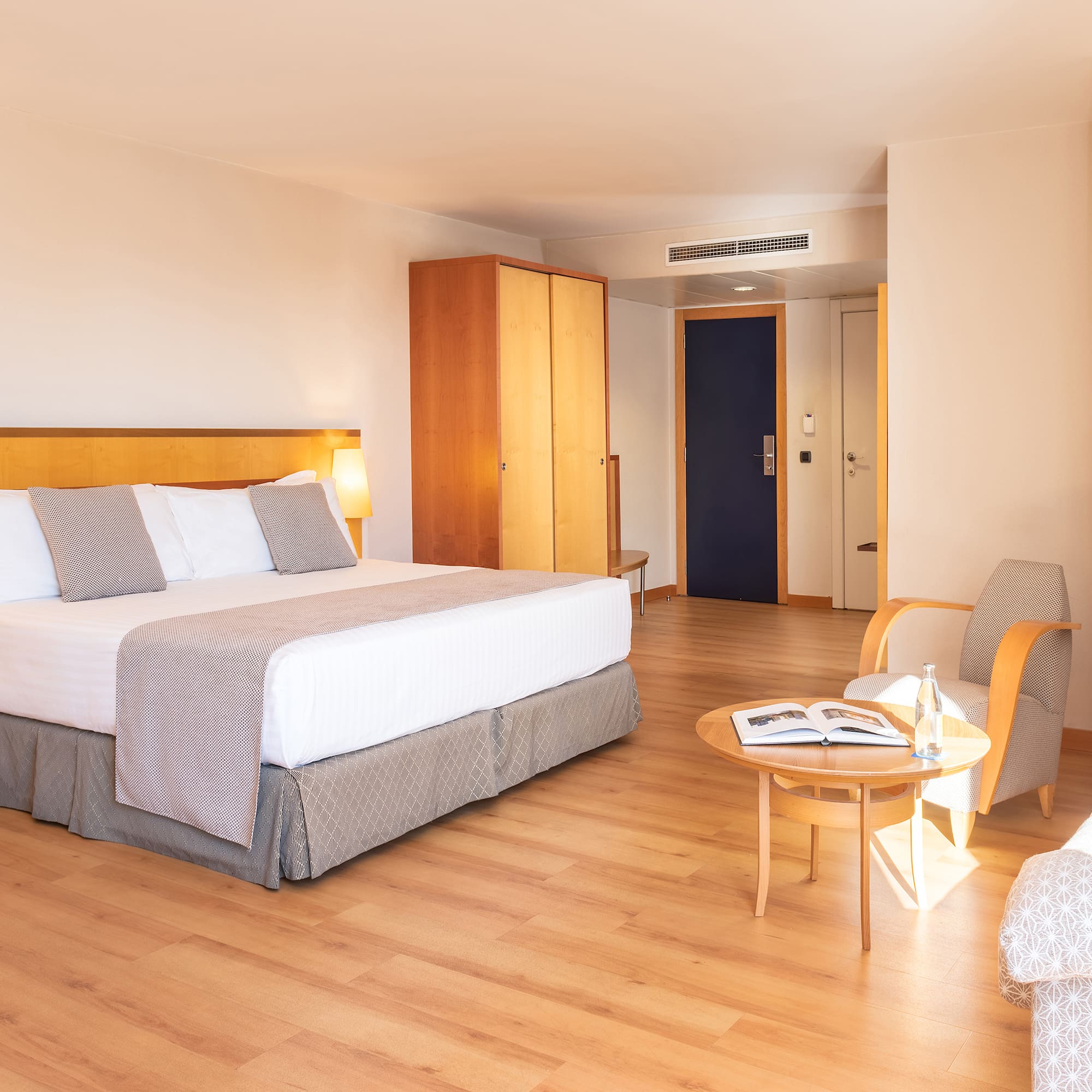 a room with a bed and a chair