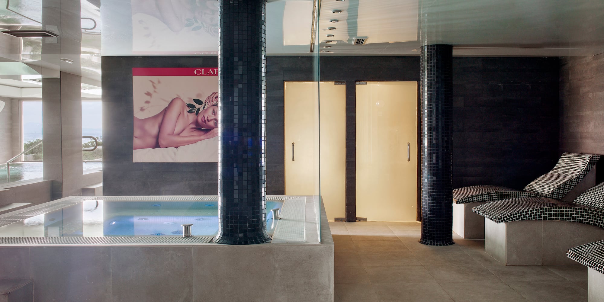 a room with a hot tub and a poster