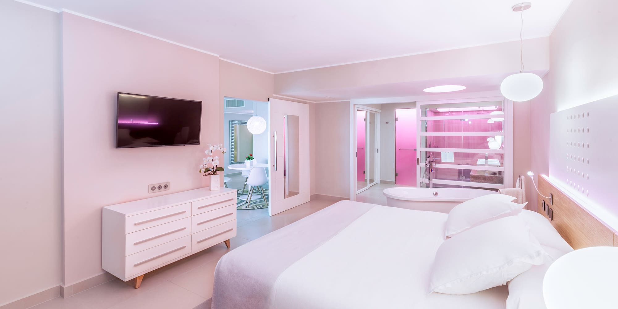 a bedroom with a large bed and a bathtub