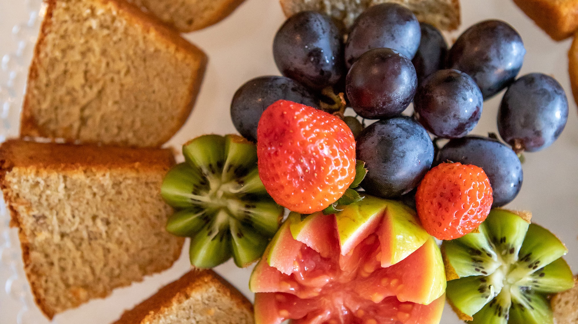 a plate of fruit and bread