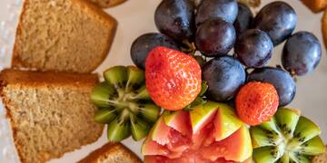 a plate of fruit and bread