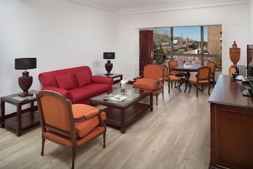 a living room with a couch and chairs