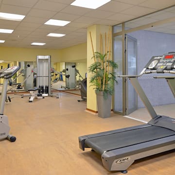 a gym with treadmills and exercise equipment
