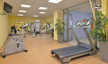 a gym with treadmills and exercise equipment