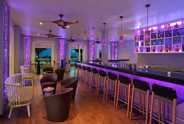 a bar with purple lights