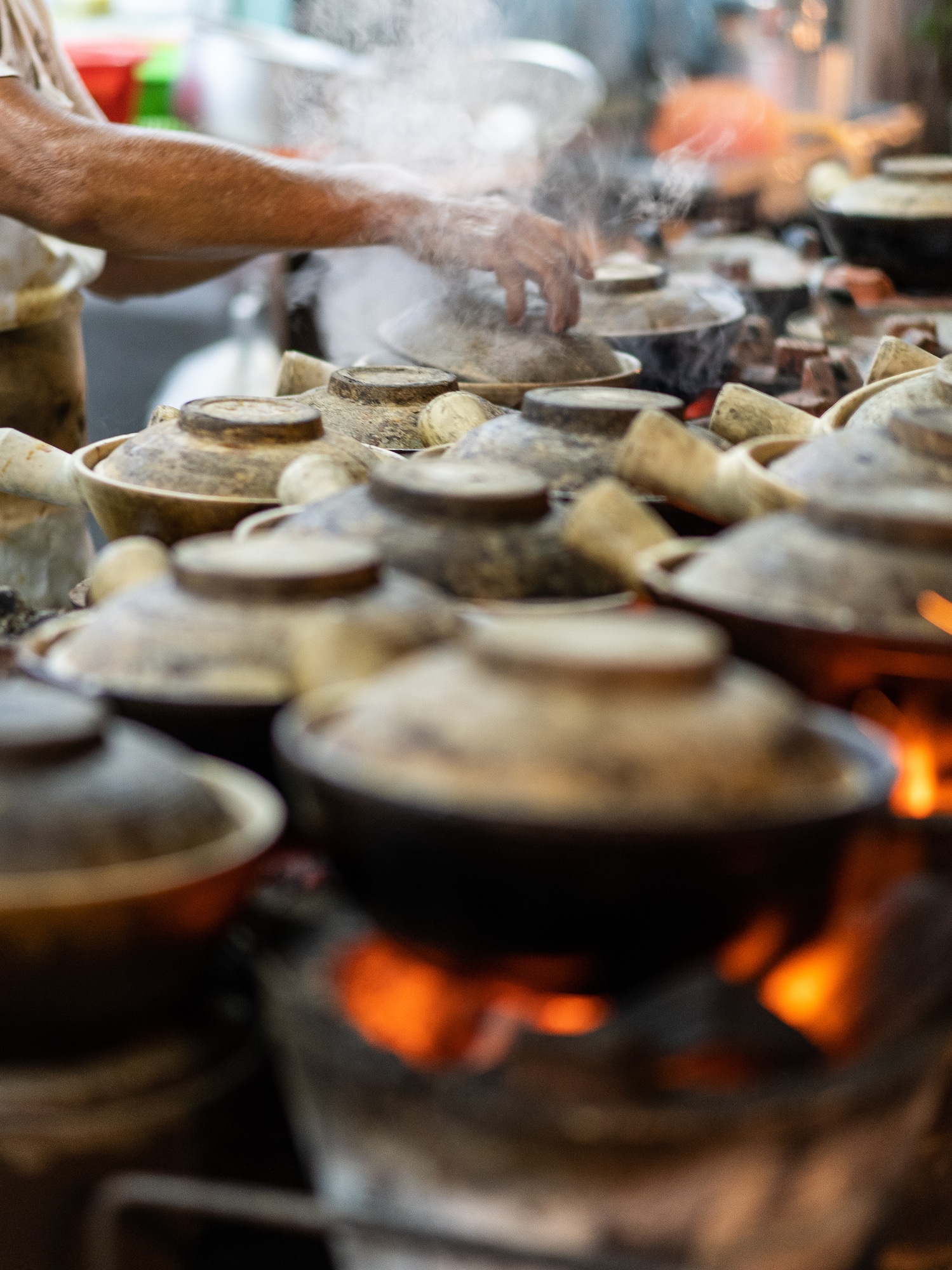 a person cooking food on a fire