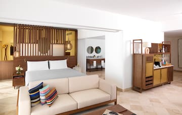 a bedroom with a bed and a couch