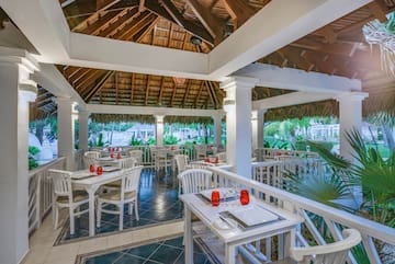 a restaurant with tables and chairs