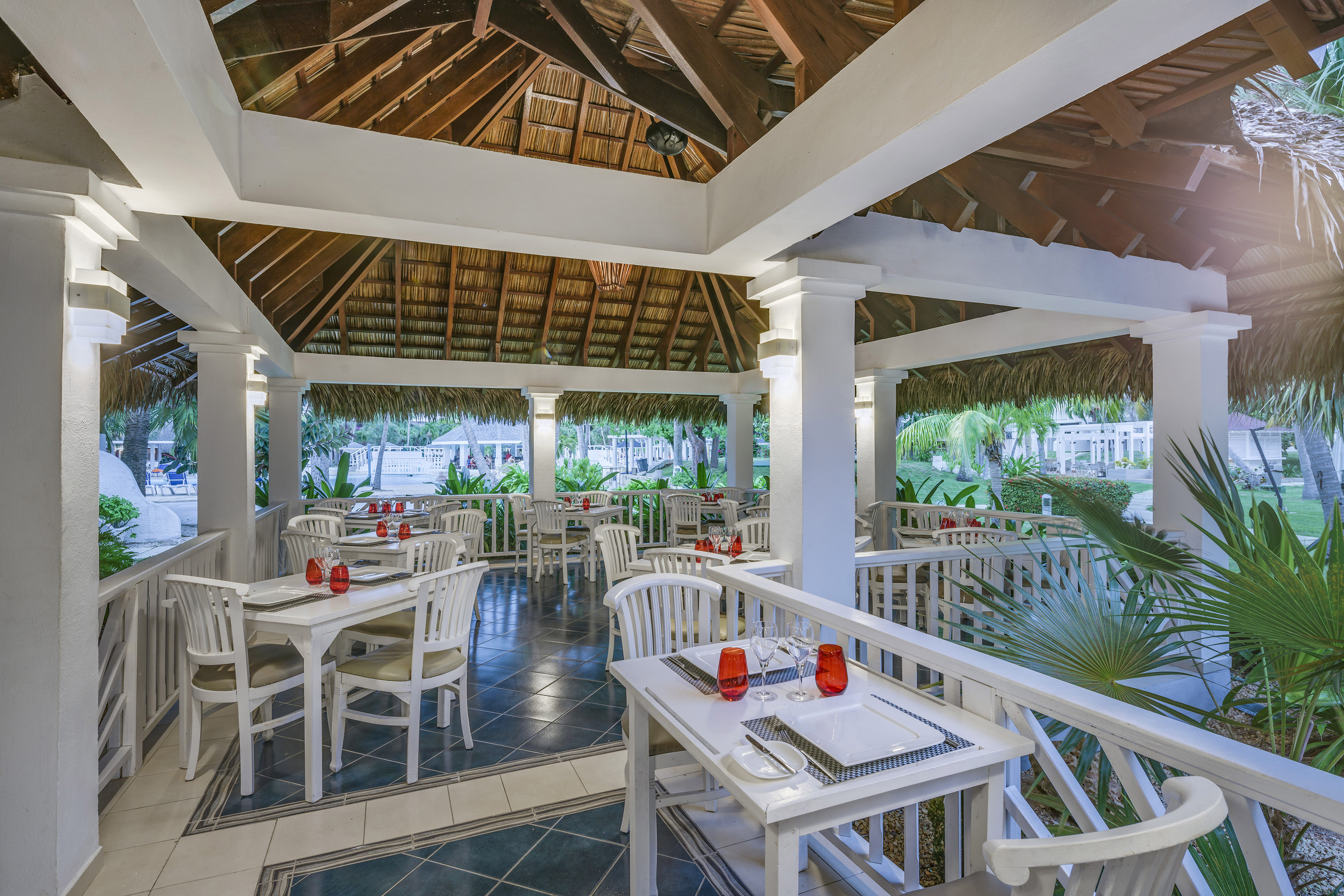 a restaurant with tables and chairs