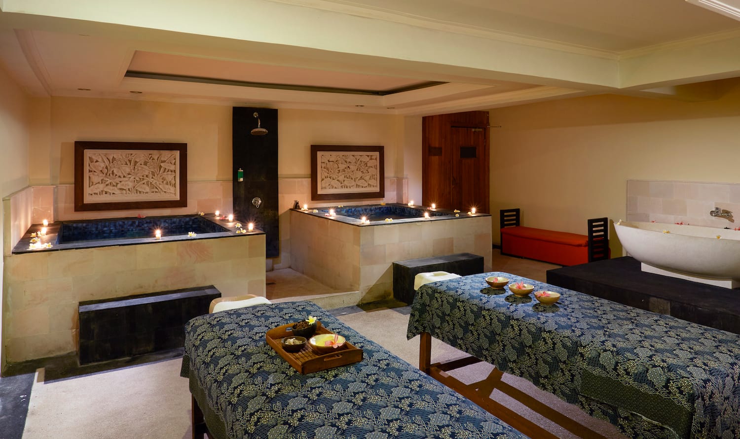 a room with tables and candles