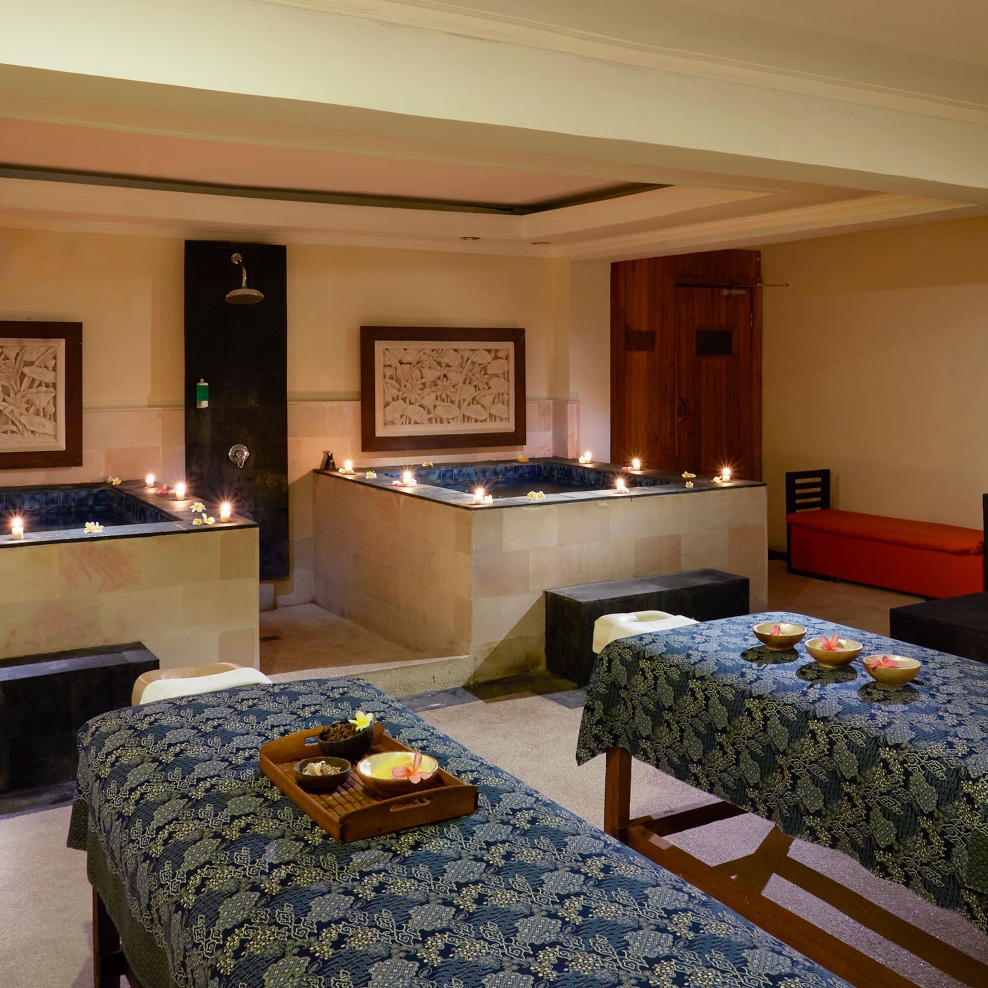 a room with tables and candles