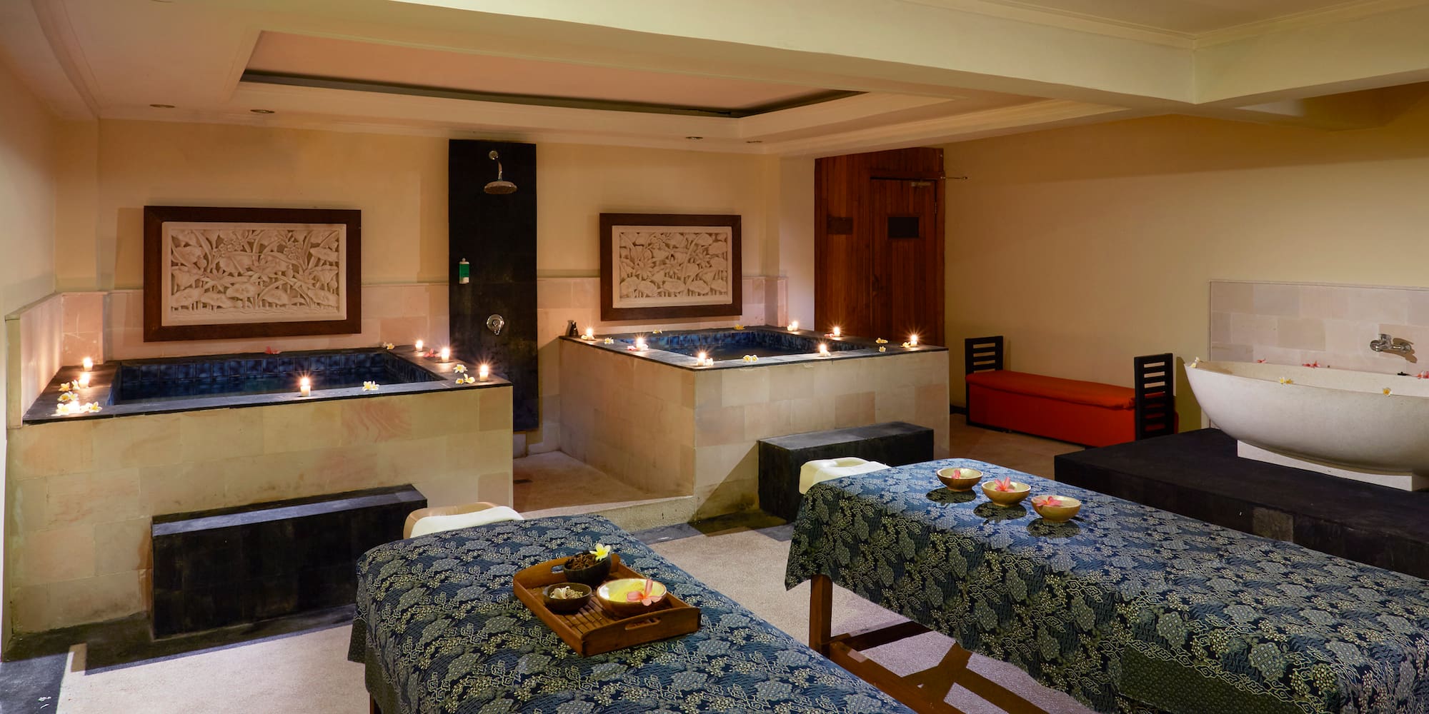 a room with tables and candles