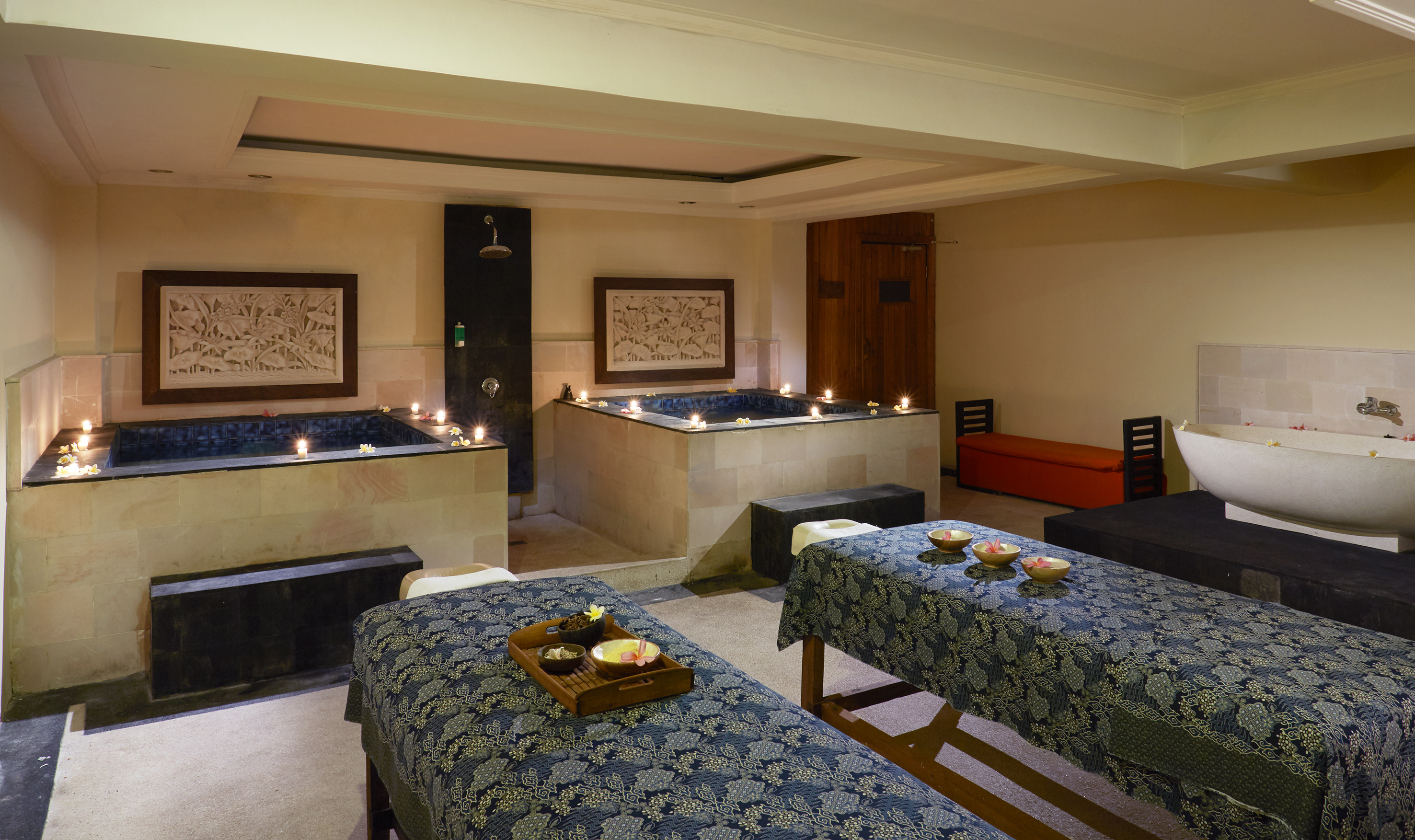 a room with tables and candles