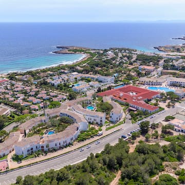 a aerial view of a town by the ocean