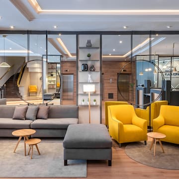 a room with yellow chairs and a couch