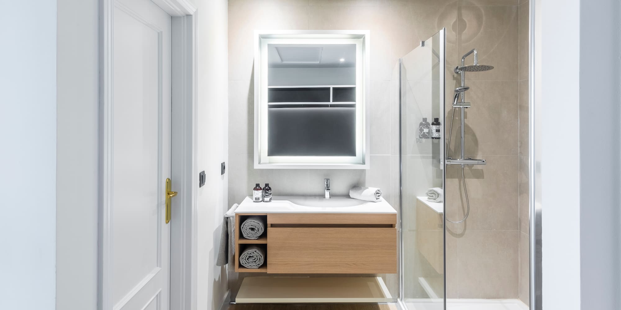 a bathroom with a shower and a sink