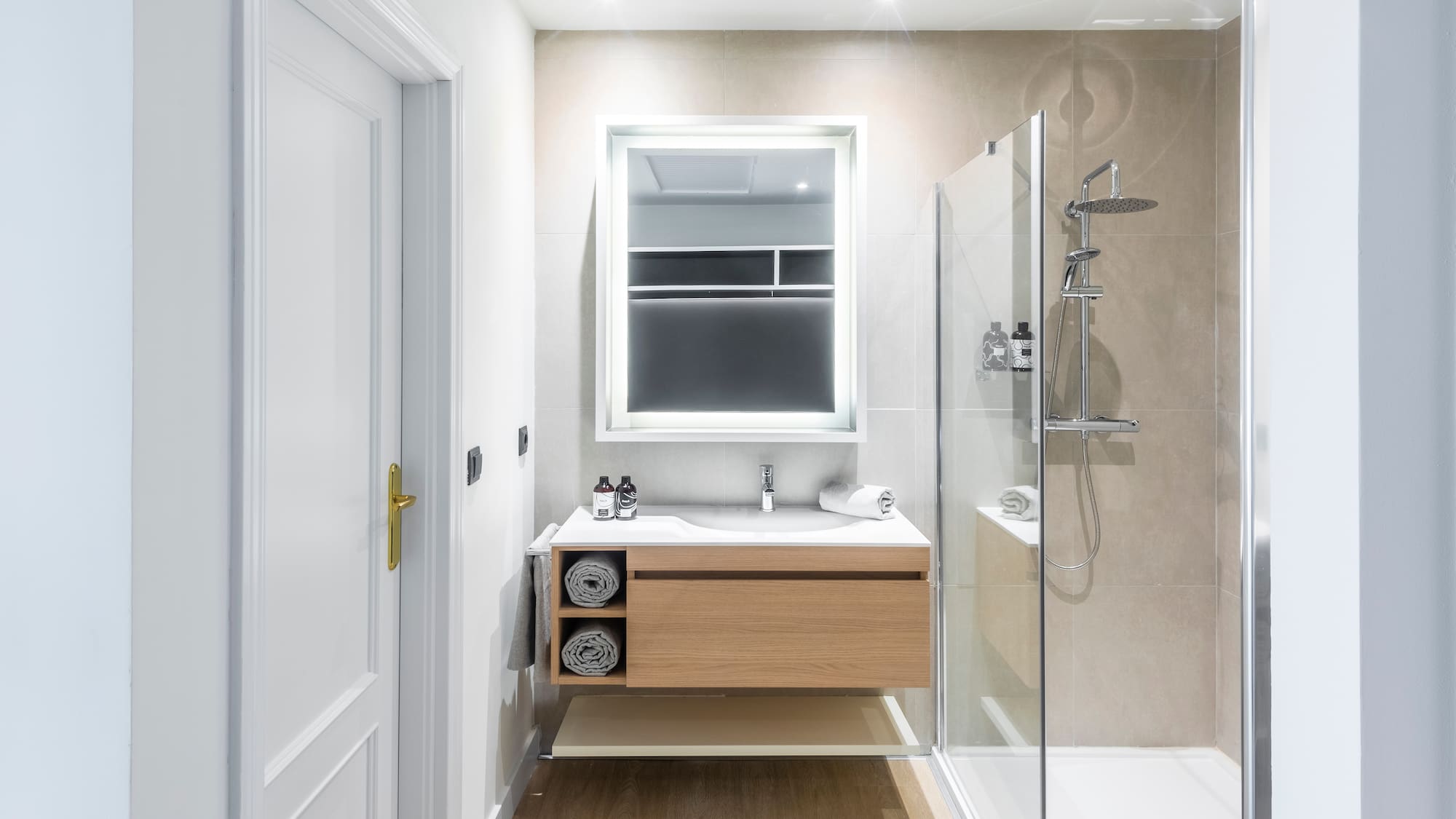 a bathroom with a shower and a sink