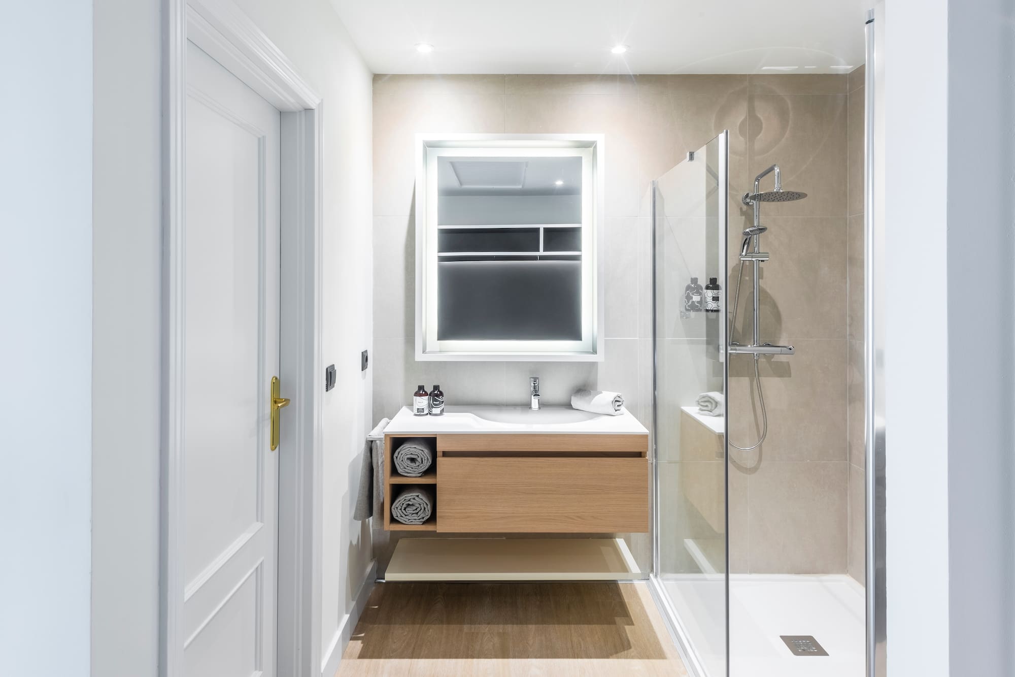 a bathroom with a shower and a sink