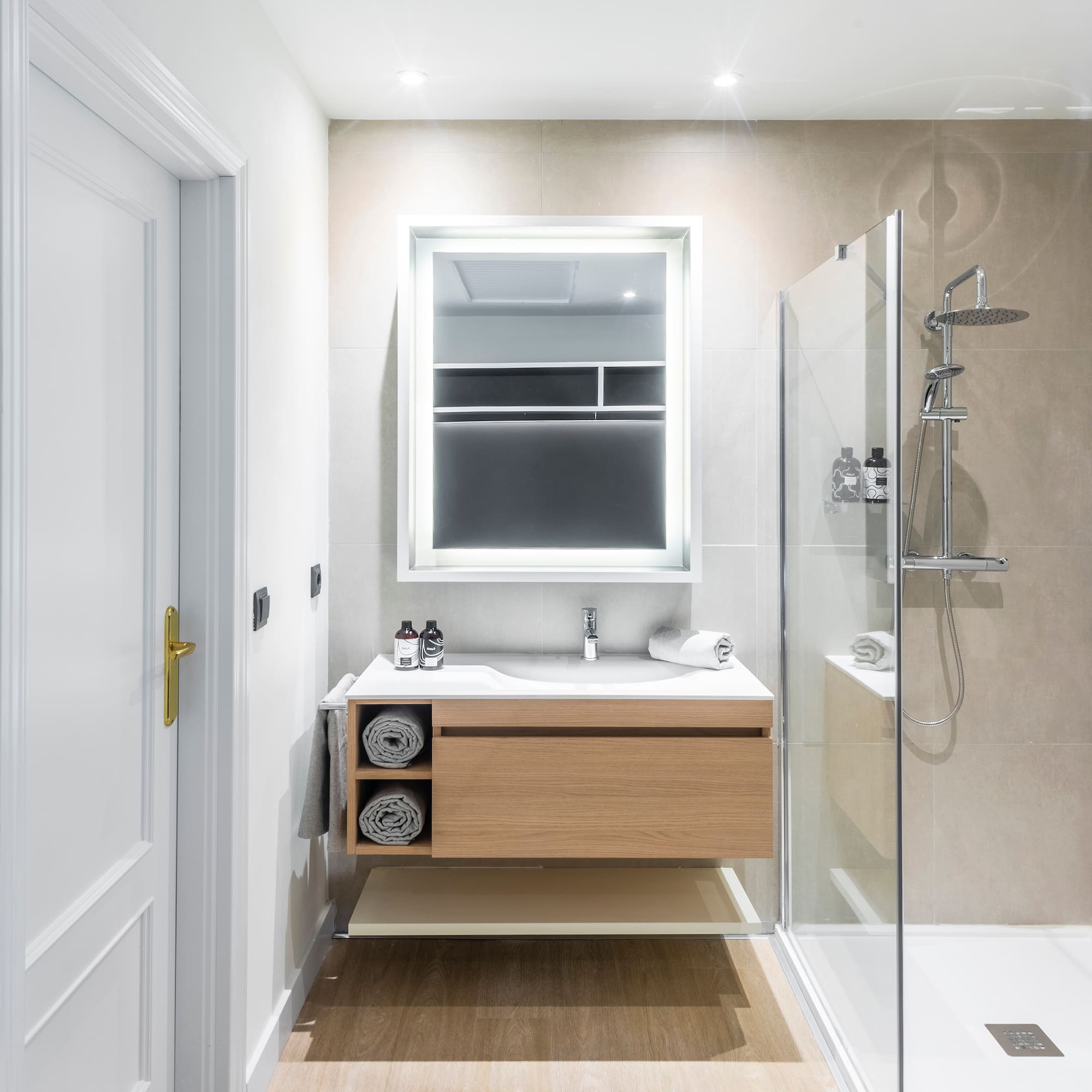 a bathroom with a shower and a sink