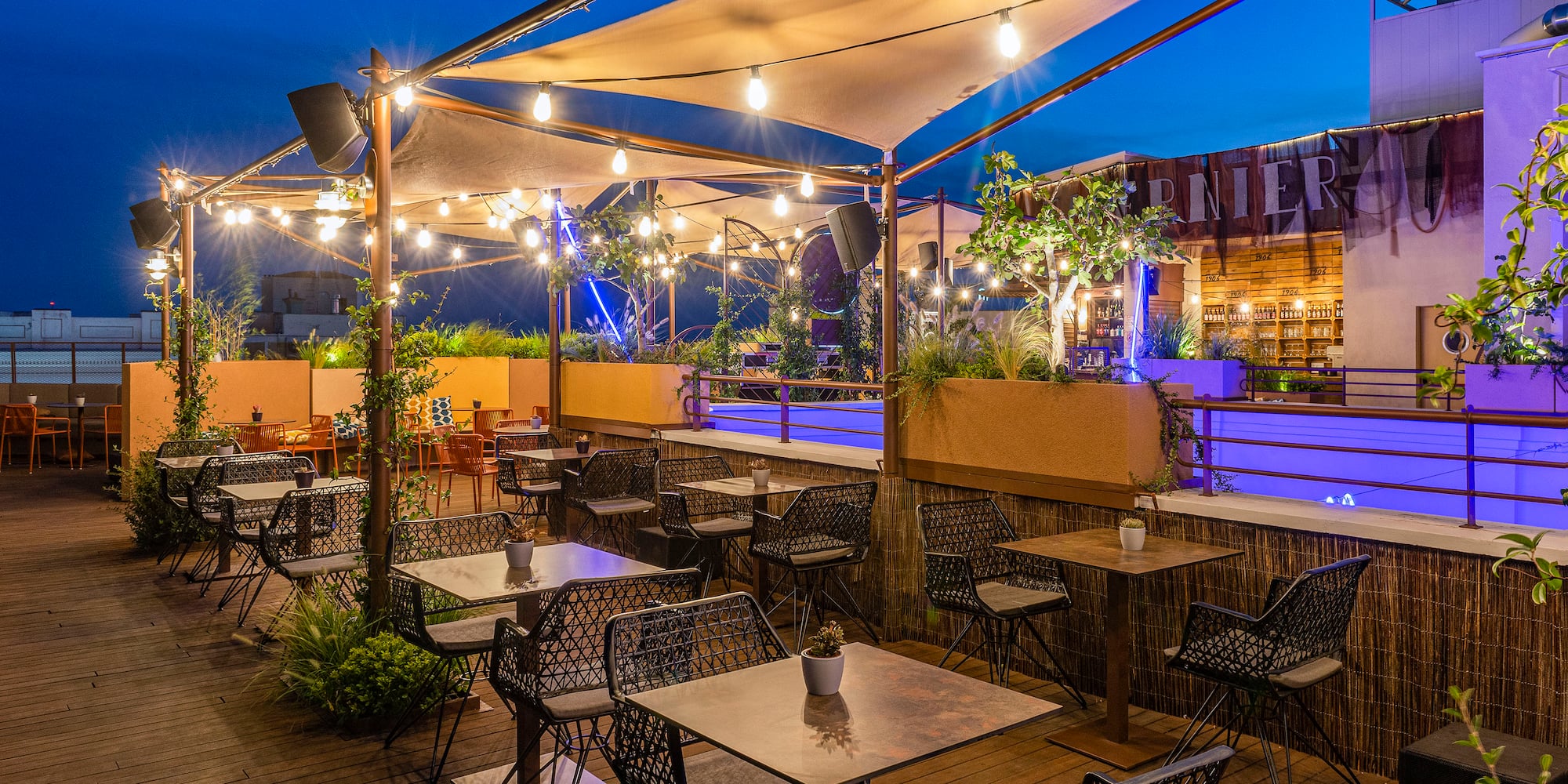 a patio with tables and chairs