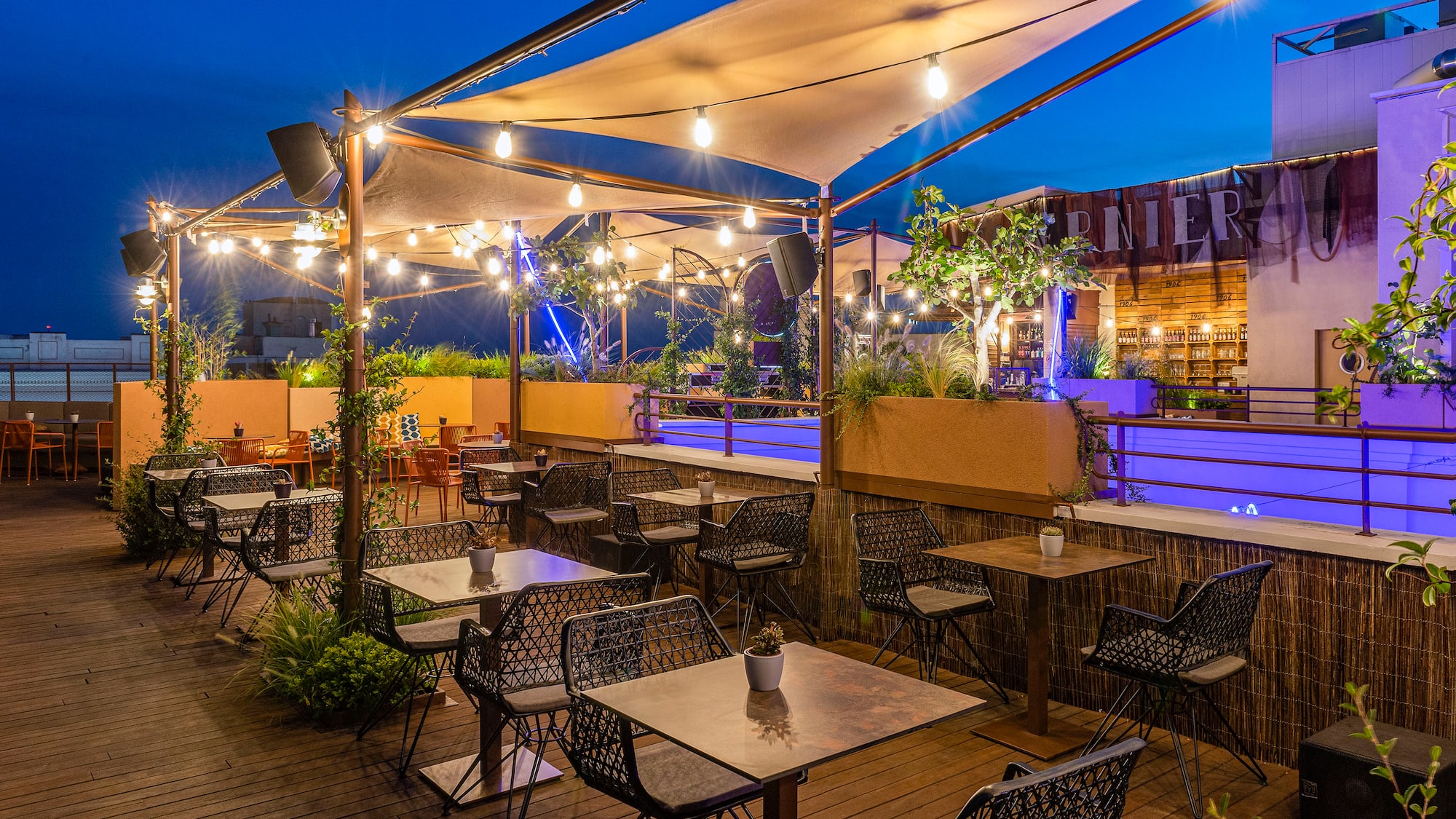 a patio with tables and chairs