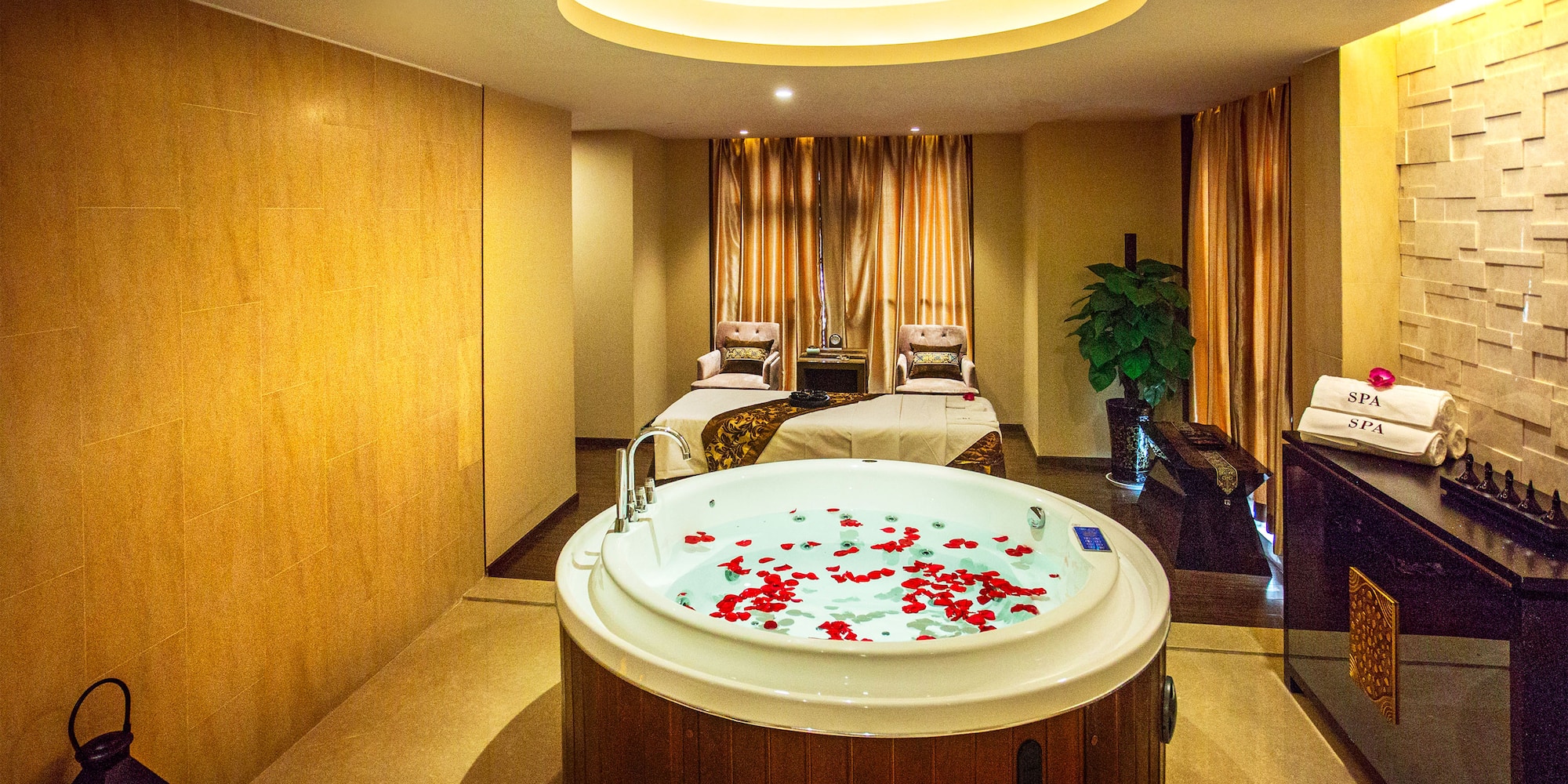 a room with a hot tub and a bed