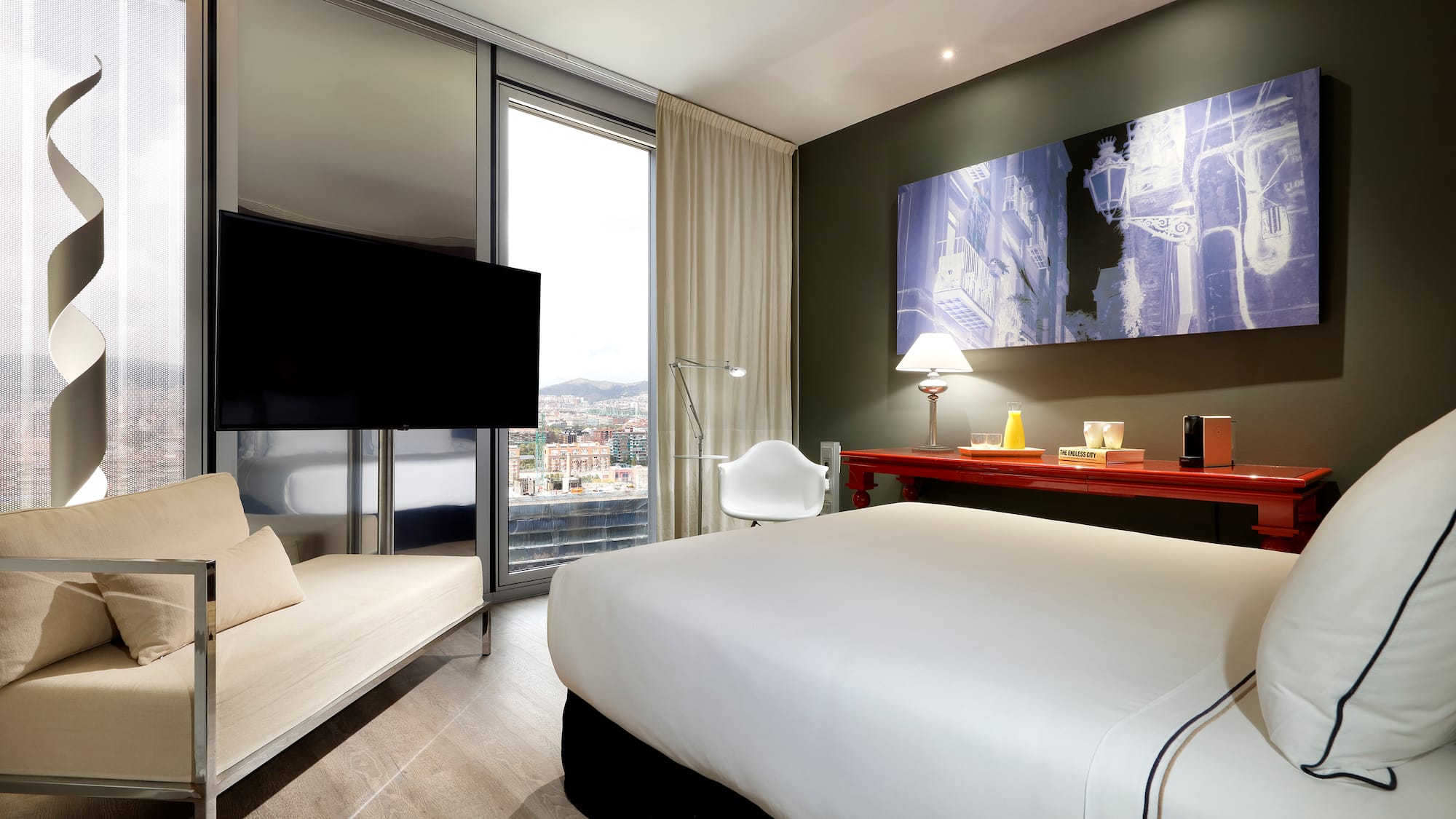 a room with a bed and a television