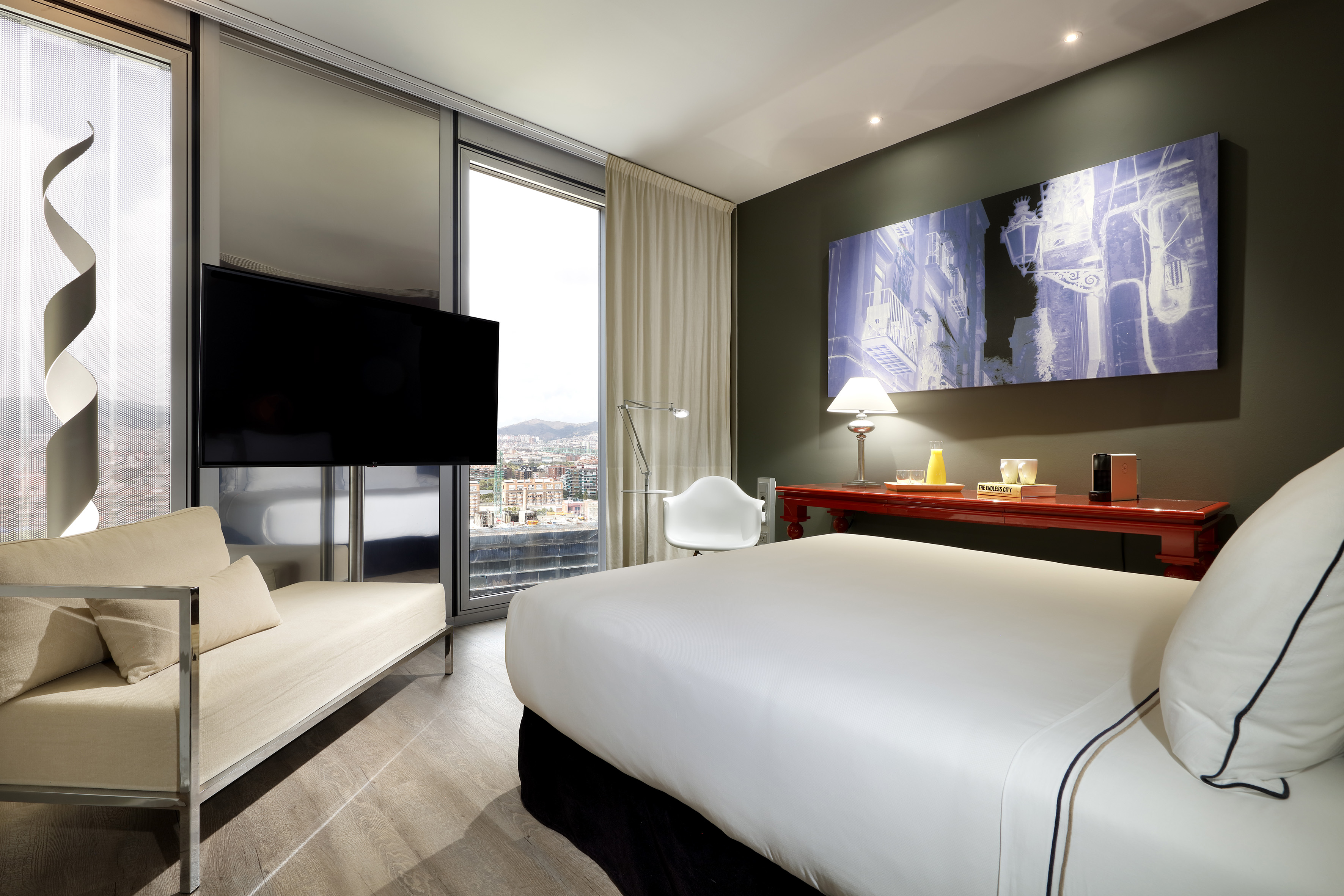 a room with a bed and a television