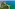 a beach with trees and a body of water