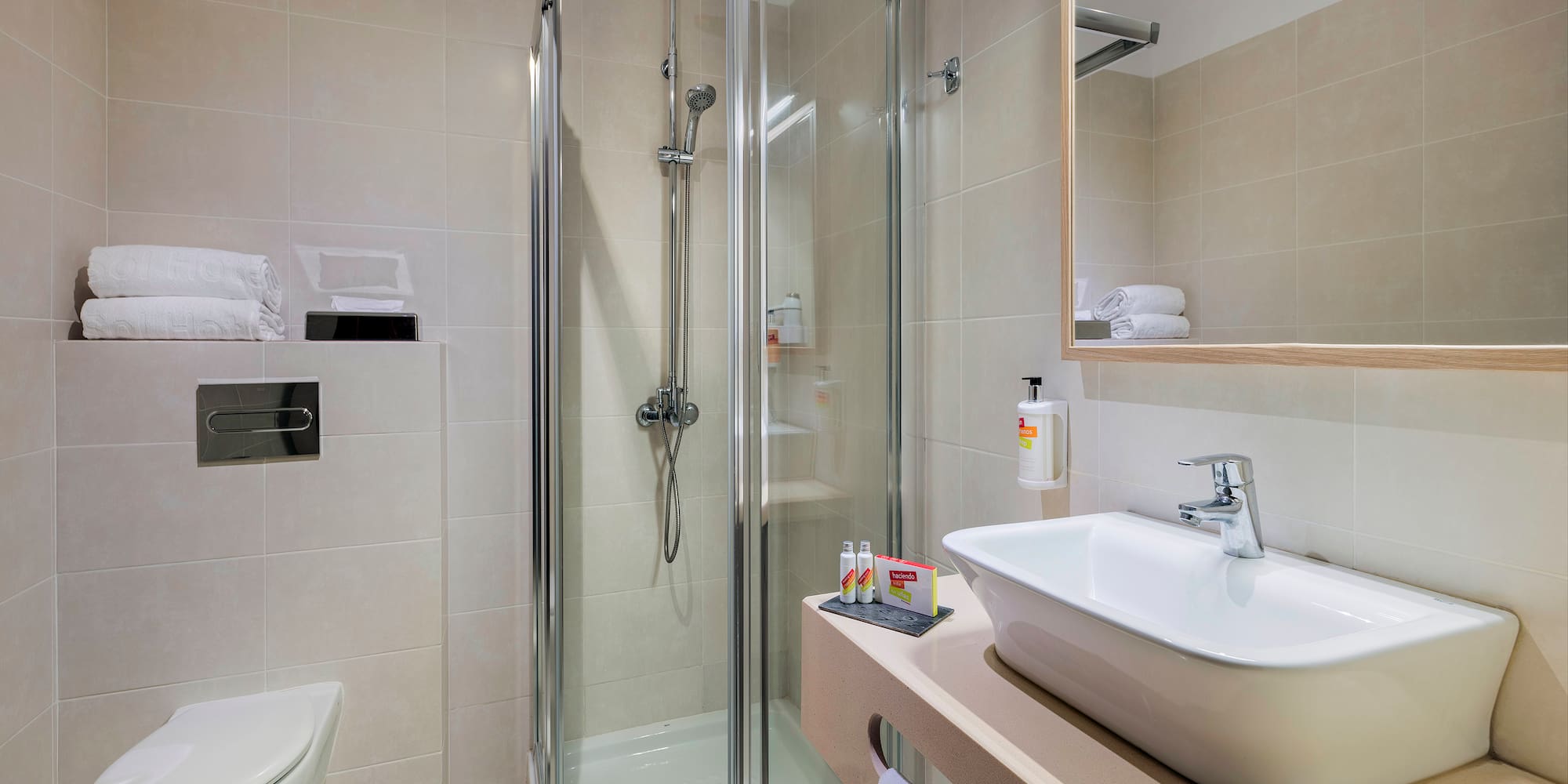 a bathroom with a shower and sink