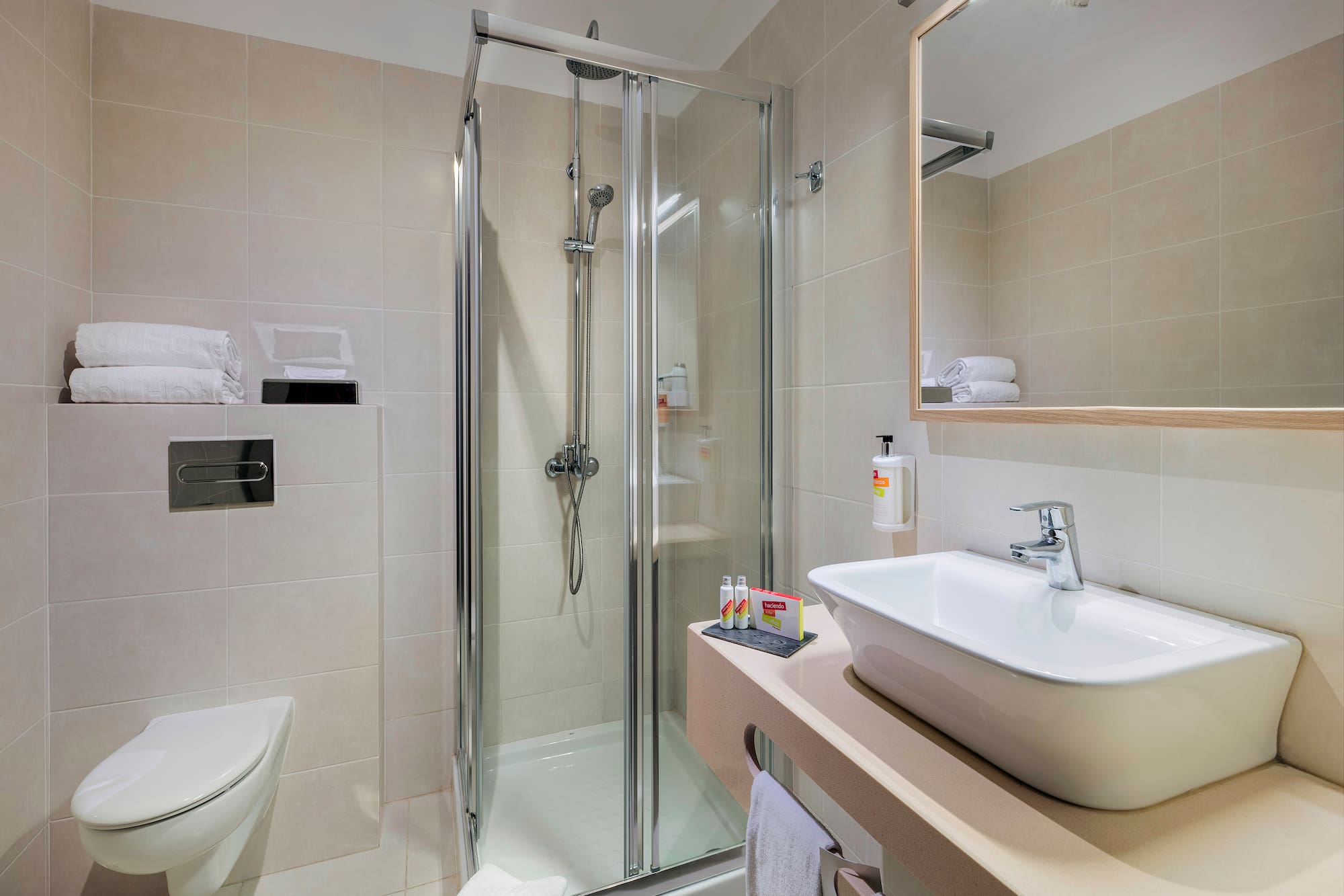 a bathroom with a shower and sink