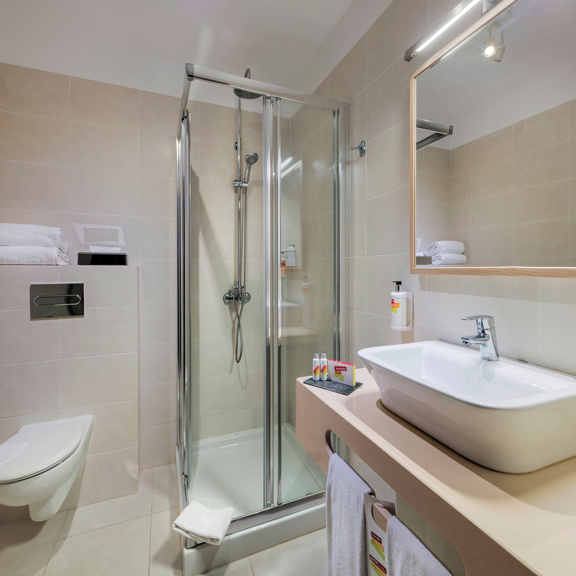 a bathroom with a shower and sink