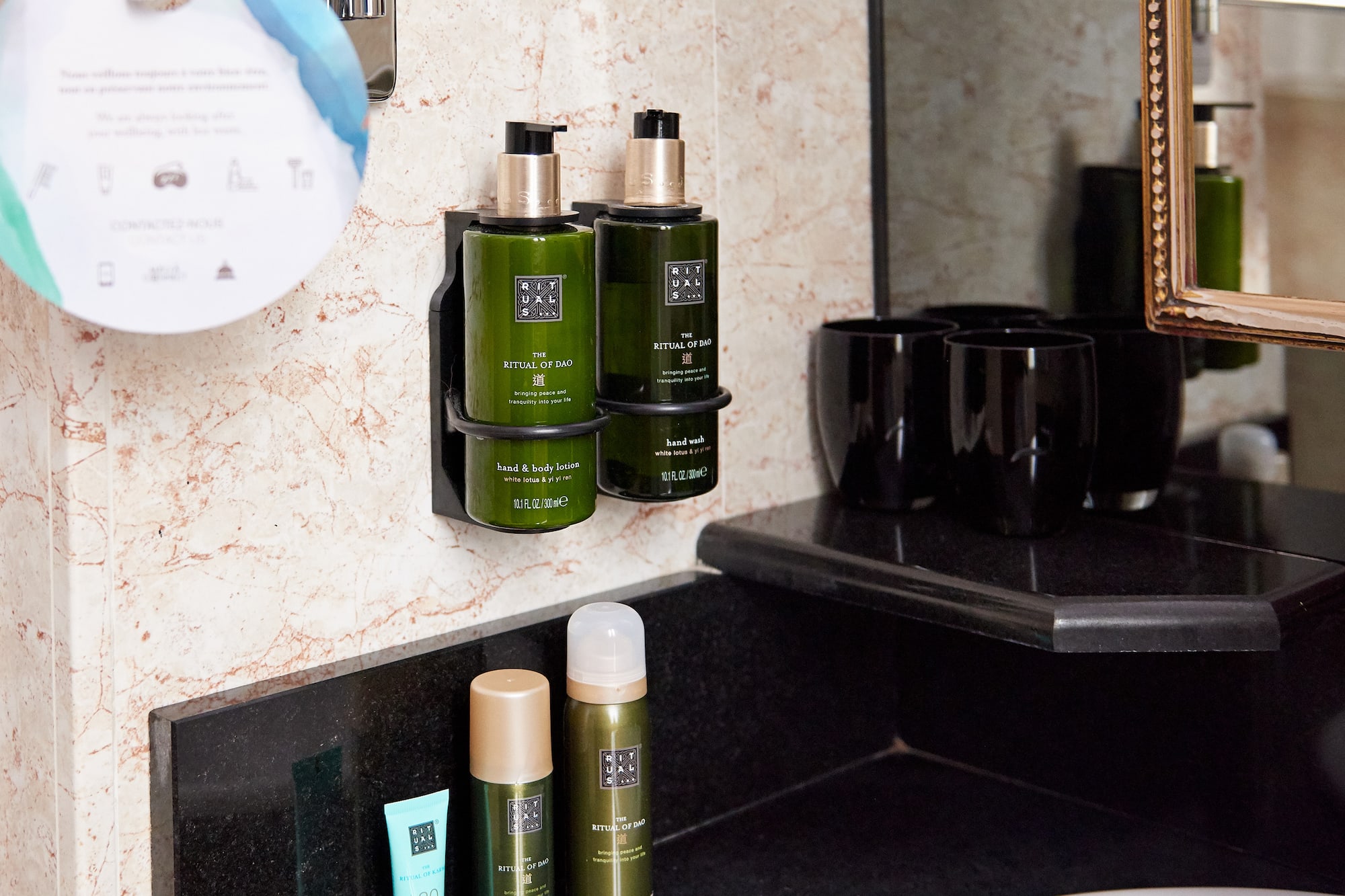 a bathroom with a mirror and a sink