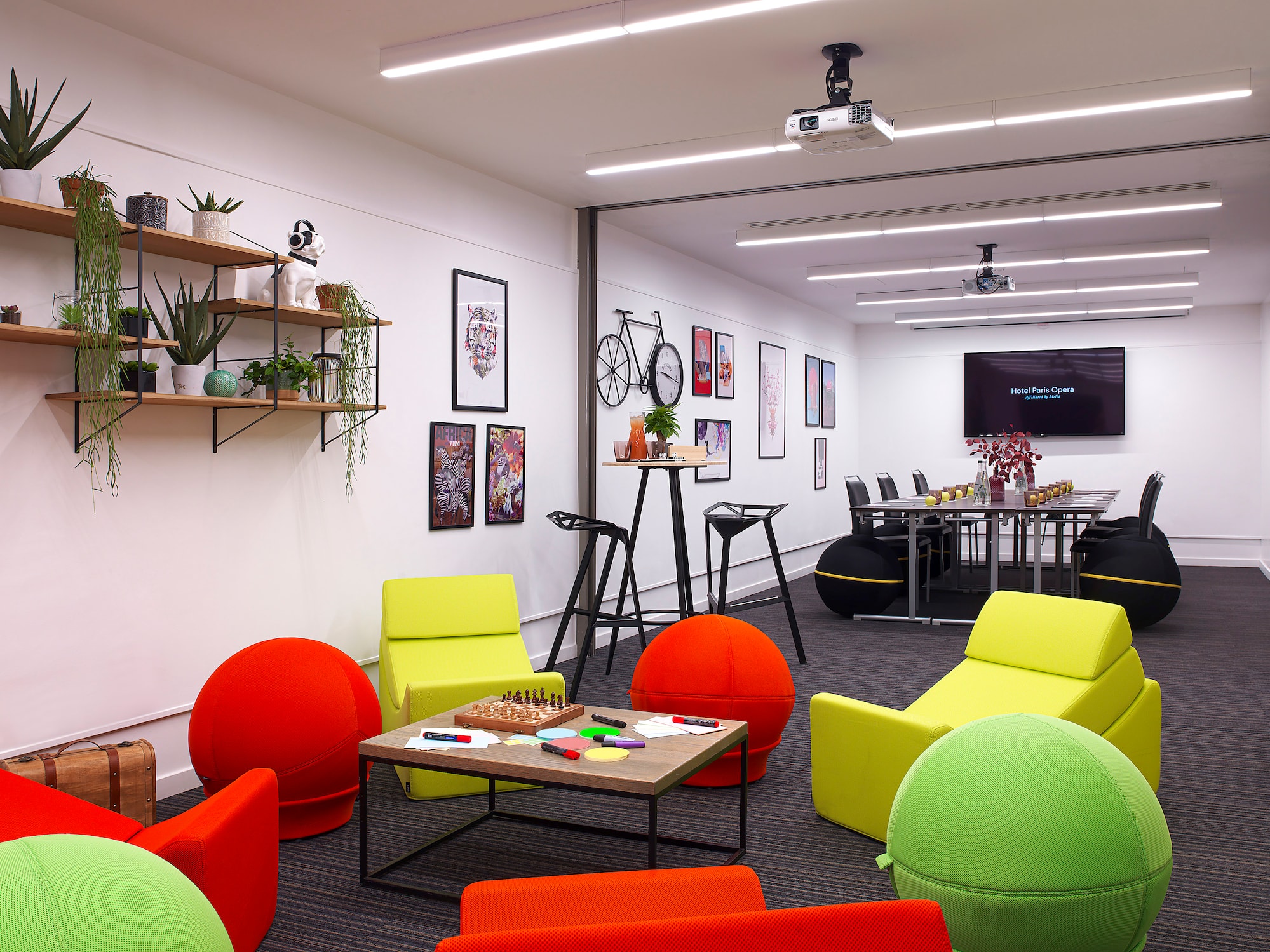 a room with colorful chairs and a table