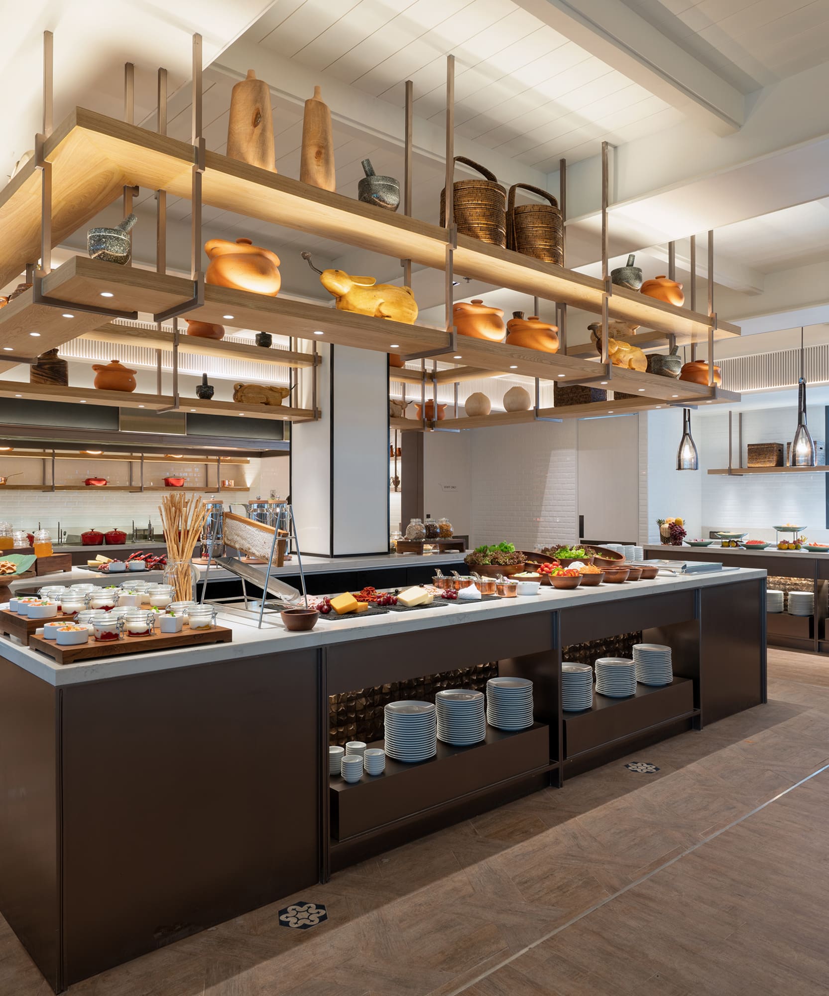 a large kitchen with food on shelves