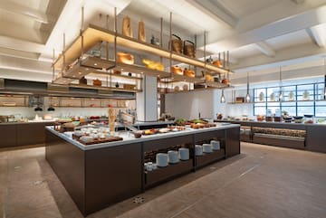a large kitchen with food on shelves
