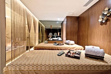 a room with beds and towels