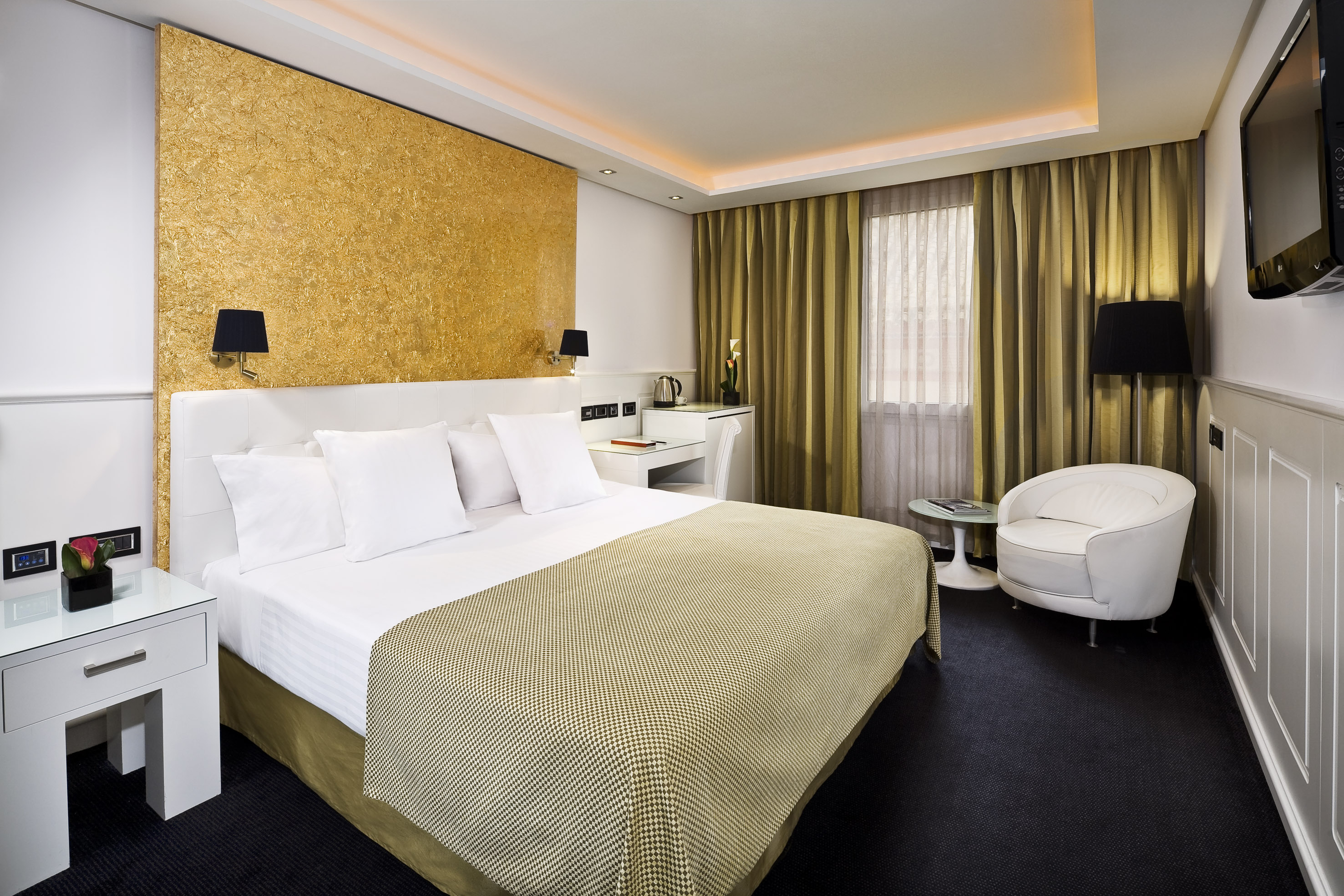 a room with a bed and a chair