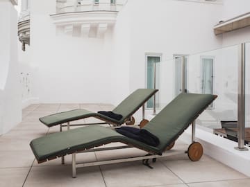 a couple of lounge chairs on a patio